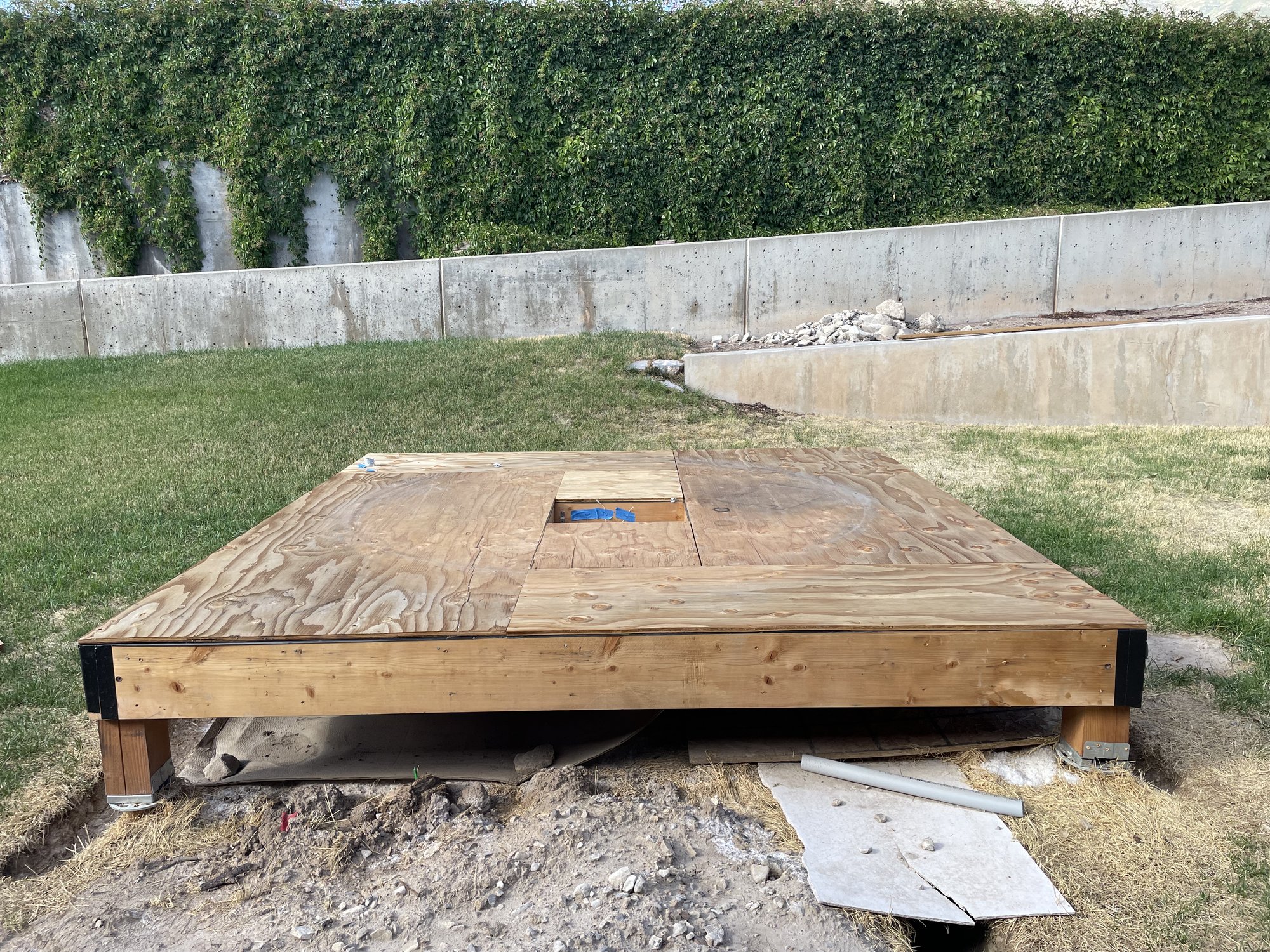 The floor platform resting on its corner posts, on top of the helical screw piers, before the walls went up