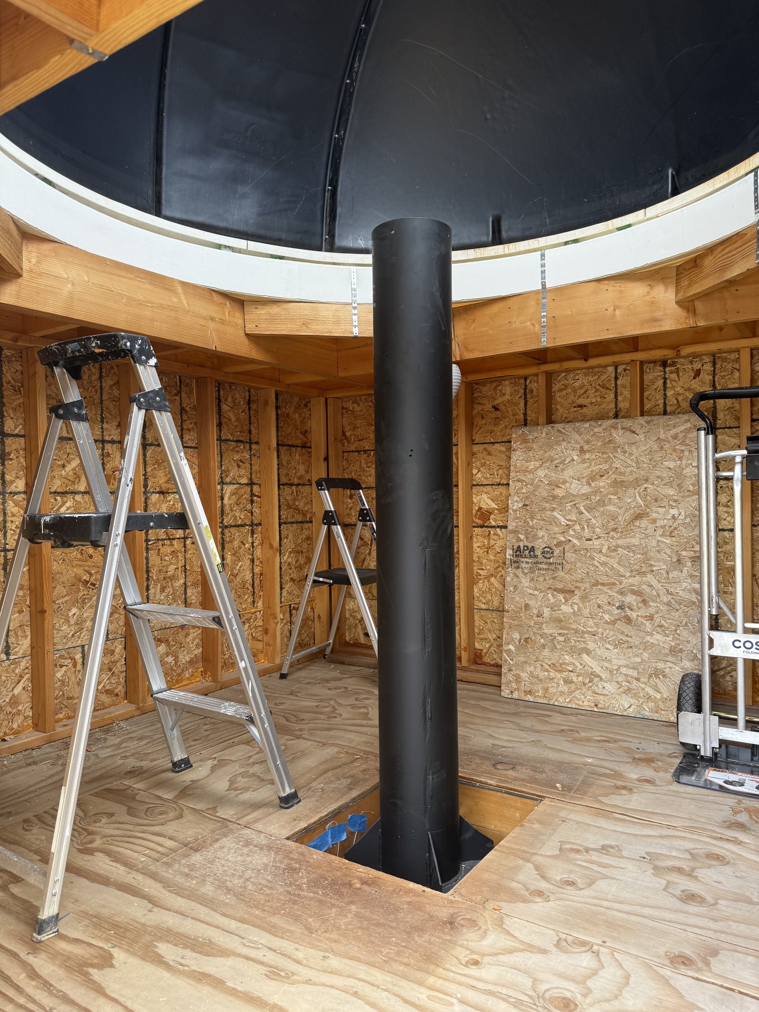 The steel pier, sandblasted and powder-coated, installed through the observatory floor